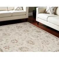 Photo of Cream Floral Power Loom Distressed Area Rug With Fringe