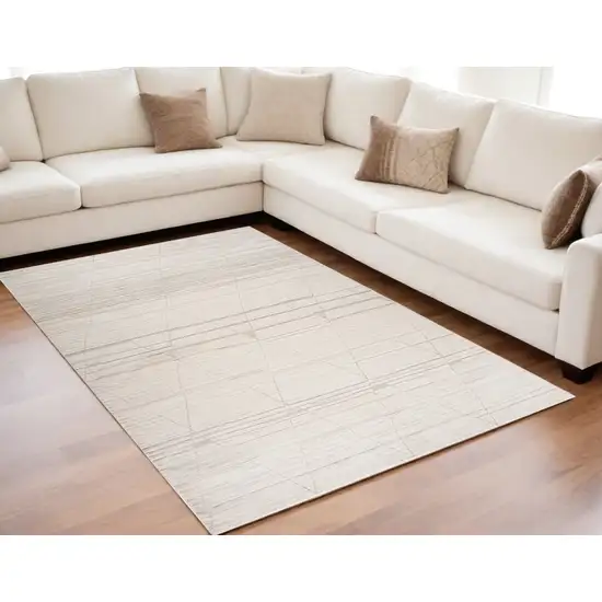 Cream and Beige Abstract Area Rug Photo 1