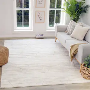 Photo of Cream and Beige Abstract Area Rug