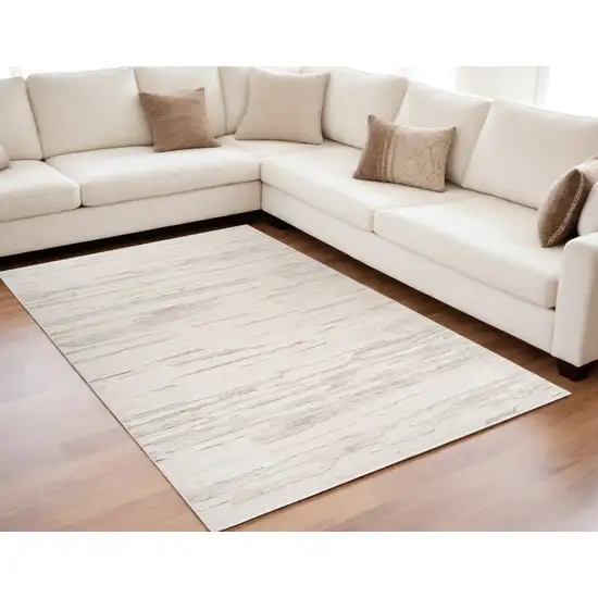 Cream and Beige Abstract Area Rug Photo 1