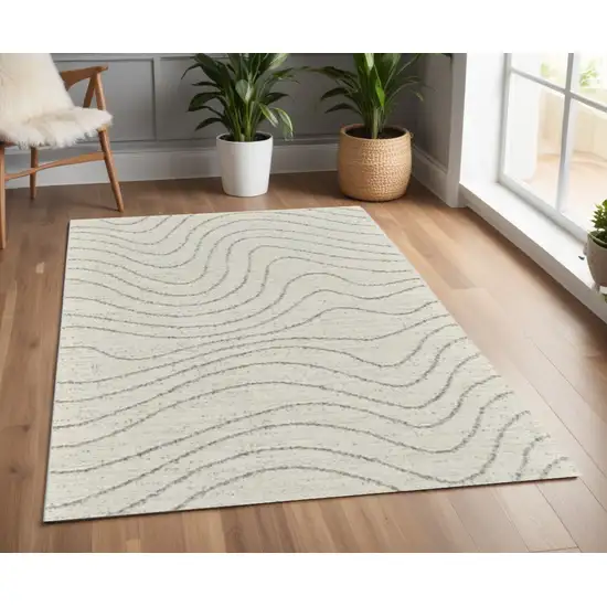 Cream and Beige Abstract Area Rug Photo 1