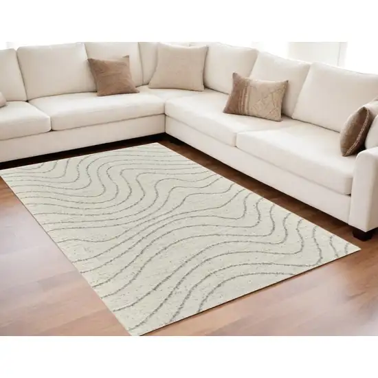 Cream and Beige Abstract Area Rug Photo 1