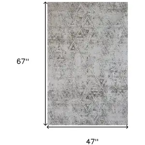 Photo of Cream and Beige Abstract Area Rug