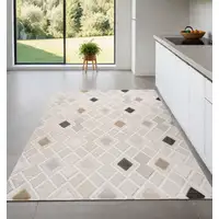 Photo of Cream and Beige Abstract Distressed Area Rug