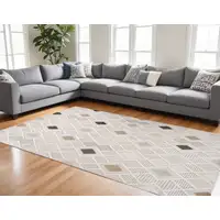 Photo of Cream and Beige Abstract Distressed Area Rug