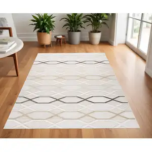 Photo of Cream and Beige Abstract Distressed Area Rug