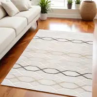 Photo of Cream and Beige Abstract Distressed Area Rug