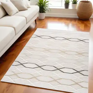 Photo of Cream and Beige Abstract Distressed Area Rug