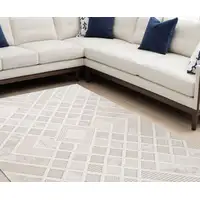 Photo of Cream and Beige Abstract Distressed Area Rug