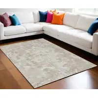 Photo of Cream and Beige Abstract Distressed Area Rug