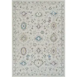 Photo of Cream and Beige Abstract Distressed Area Rug