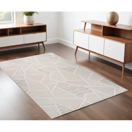 Cream and Beige Geometric Distressed Area Rug Photo 1