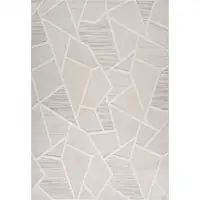 Photo of Cream and Beige Geometric Distressed Area Rug