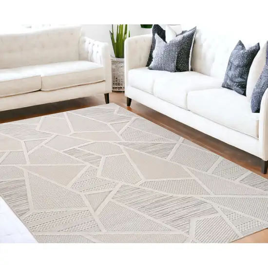 Cream and Beige Geometric Distressed Area Rug Photo 1