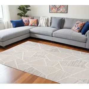 Photo of Cream and Beige Geometric Distressed Area Rug