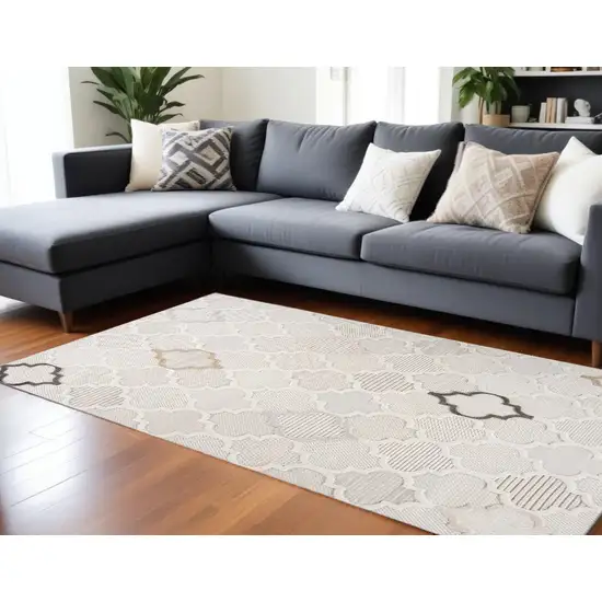 Cream and Beige Geometric Distressed Area Rug Photo 1