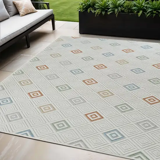 Cream and Beige Geometric Distressed Indoor Outdoor Area Rug Photo 1