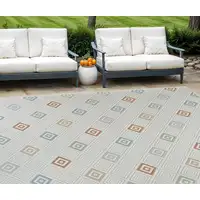 Photo of Cream and Beige Geometric Distressed Indoor Outdoor Area Rug