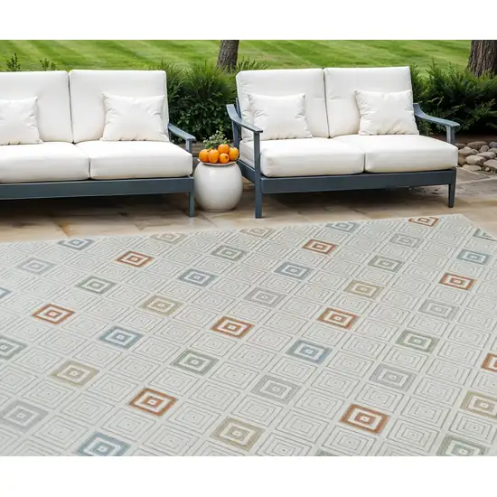 Cream and Beige Geometric Distressed Indoor Outdoor Area Rug Photo 1