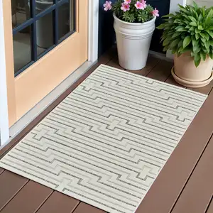 Photo of Cream and Beige Geometric Distressed Indoor Outdoor Area Rug