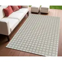 Photo of Cream and Beige Geometric Distressed Indoor Outdoor Area Rug