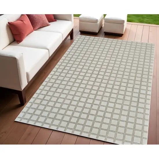 Cream and Beige Geometric Distressed Indoor Outdoor Area Rug Photo 1