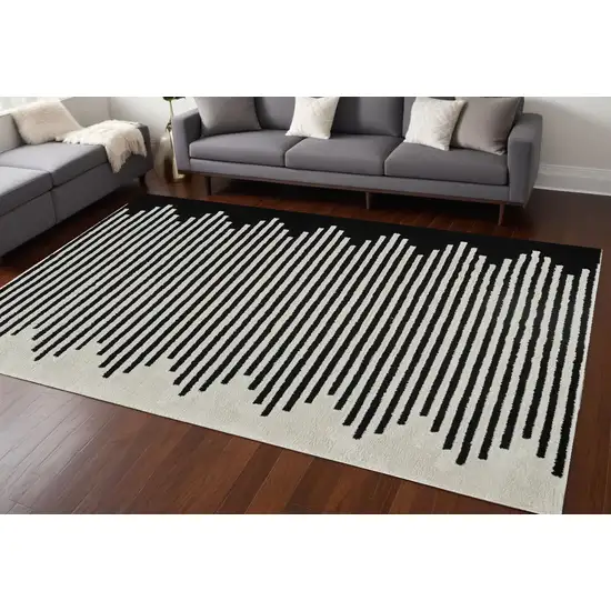 Cream and Black Abstract Distressed Area Rug Photo 1