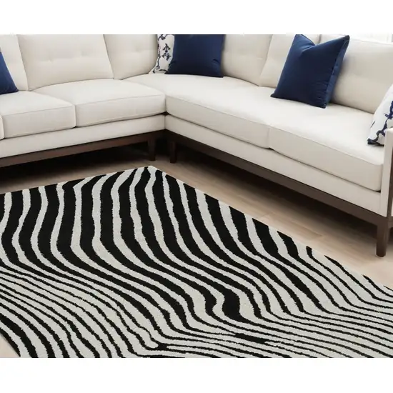 Cream and Black Abstract Distressed Area Rug Photo 1