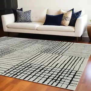 Photo of Cream and Black Abstract Distressed Area Rug