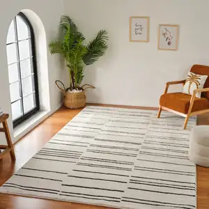 Photo of Cream and Black Abstract Distressed Area Rug