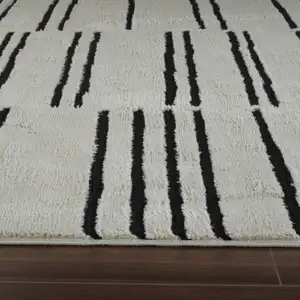 Photo of Cream and Black Abstract Distressed Area Rug