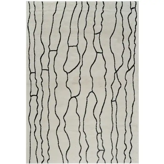 Cream and Black Abstract Distressed Area Rug Photo 1