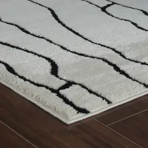 Photo of Cream and Black Abstract Distressed Area Rug