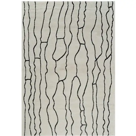 Cream and Black Abstract Distressed Area Rug Photo 1