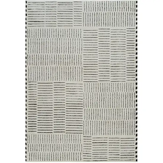 Cream and Black Abstract Distressed Area Rug Photo 1