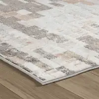 Photo of Cream and Brown Abstract Distressed Area Rug