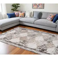 Photo of Cream and Brown Abstract Distressed Area Rug