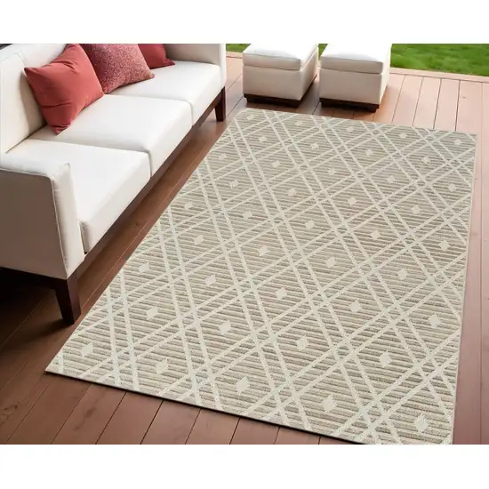 Cream and Brown Geometric Distressed Indoor Outdoor Area Rug Photo 1