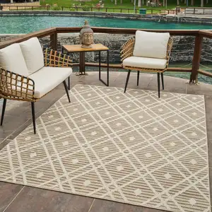 Photo of Cream and Brown Geometric Distressed Indoor Outdoor Area Rug