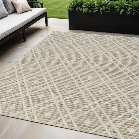 Cream and Brown Geometric Distressed Indoor Outdoor Area Rug Photo 1