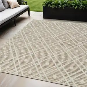 Photo of Cream and Brown Geometric Distressed Indoor Outdoor Area Rug