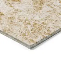 Photo of Cream and Gold Abstract Washable Non Skid Indoor Outdoor Area Rug