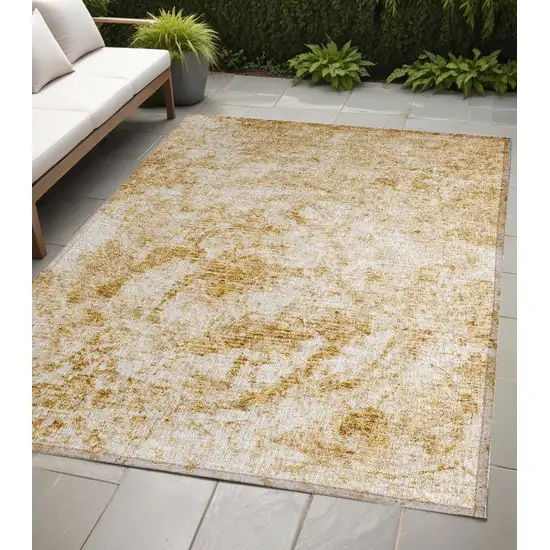 Cream and Gold Abstract Washable Non Skid Indoor Outdoor Area Rug Photo 1