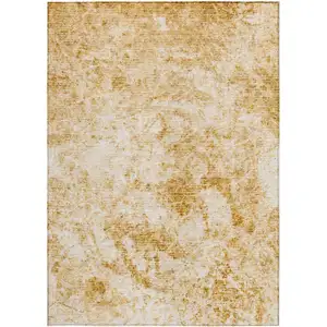 Photo of Cream and Gold Abstract Washable Non Skid Indoor Outdoor Area Rug