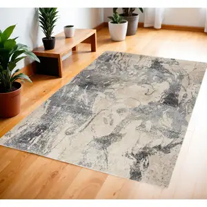 Photo of Cream and Gray Abstract Distressed Area Rug