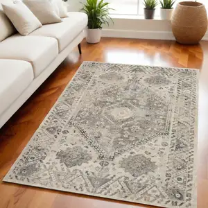 Photo of Cream and Gray Floral Distressed Area Rug