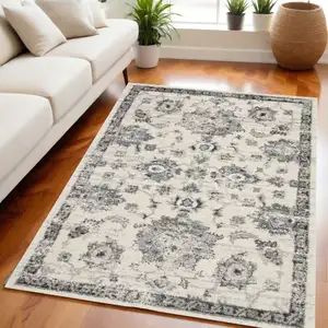 Photo of Cream and Gray Floral Distressed Area Rug