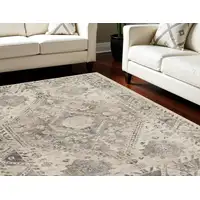 Photo of Cream and Gray Floral Distressed Area Rug