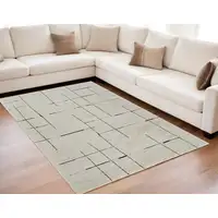 Photo of Cream and Green Abstract Distressed Area Rug