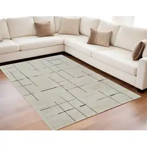 Photo of Cream and Green Abstract Distressed Area Rug